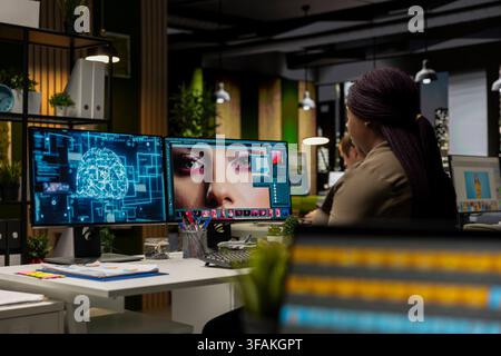 African american photo editor uses AI neural networks for retouching content, machine learning and editing for new content online. Professional graphic designer using digital software. Stock Photo