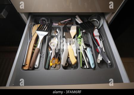 Drawer full of cooking tools and utensils Stock Photo