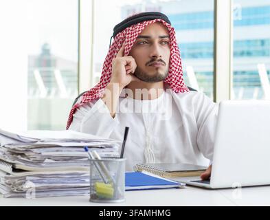 Arab businessman works in office Stock Photo