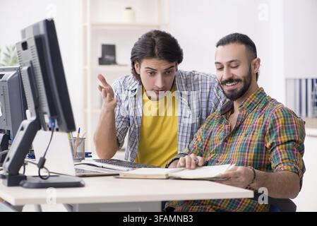 The two IT specialists who work in the office Stock Photo