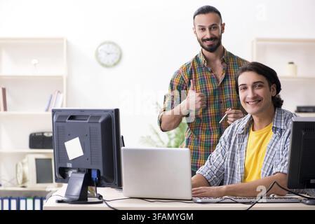 The two IT specialists who work in the office Stock Photo