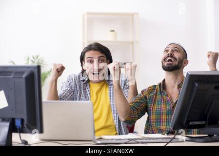 Two IT specialists working in an office Stock Photo