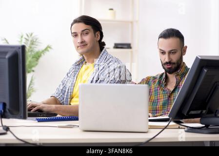 The two IT specialists who work in the office Stock Photo