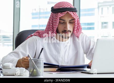 Arab businessman works in office Stock Photo
