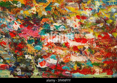 Vibrant abstract paint texture with thick layered strokes across an artist palette Stock Photo