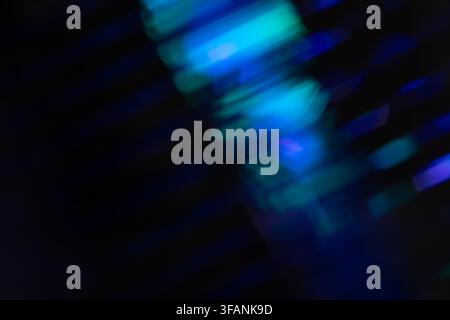 Blue and cyan motion blurred light streaks on deep black background for futuristic digital overlay and dynamic abstract design Stock Photo