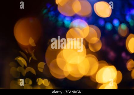 Large golden bokeh circles over blue green prismatic background for festive party banner holiday or celebration design Stock Photo