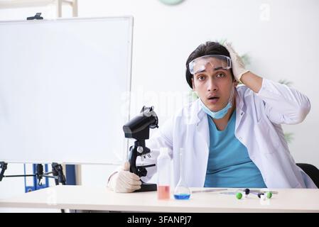 Young male chemist working in laboratory Stock Photo