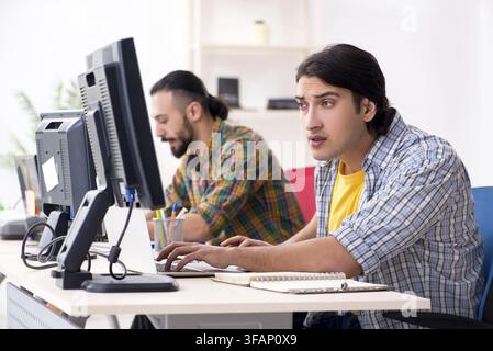The two IT specialists who work in the office Stock Photo