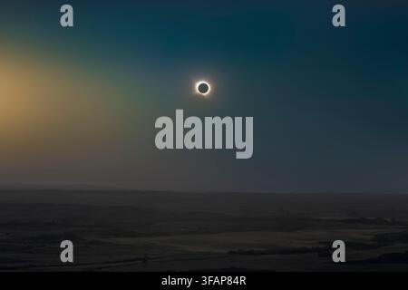 Total solar eclipse totality phase showing the solar corona over the landscape of Alcaniz, Aragon, Spain during the astronomical event August 12, 2026 Stock Photo