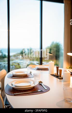 Elegant dinner table set with a scenic view Stock Photo
