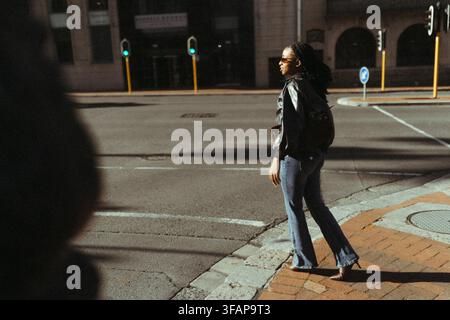 Young black female on a busy street Stock Photo