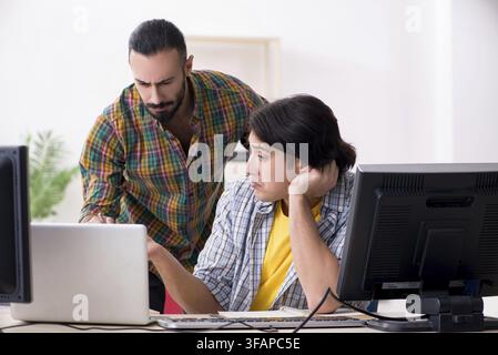 The two IT specialists who work in the office Stock Photo