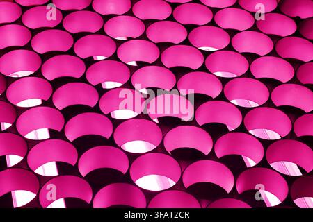 Abstract Pattern of Repeating Pink Circular Forms with Reflections and Geometric Rhythm Stock Photo