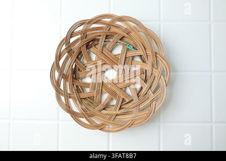 Piring Lidi, Plates Made from Woven Sticks or Rattan on White Table Stock Photo