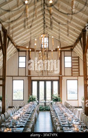 Elegant rustic wedding reception in barn venue Stock Photo
