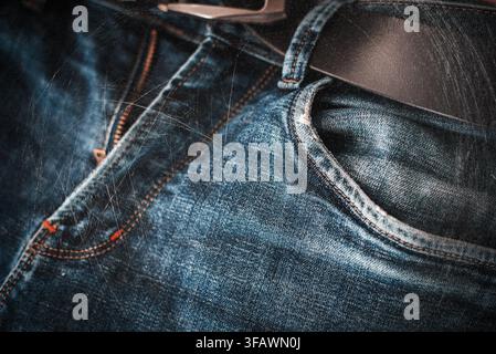 Close up of a pocket on blue denim jeans, clothing and fashion detail with stitching texture. Stock Photo