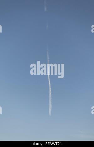A thin, textured white vertical line centered on a smooth, light blue gradient background. The image features a minimalist, clean, and sharp aesthetic Stock Photo