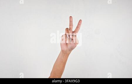 asian man making a peace sign Stock Photo