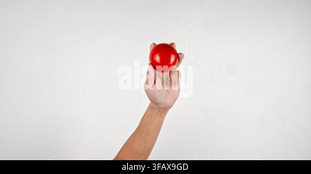 Asian man hand ready to hand a gyro ball Stock Photo