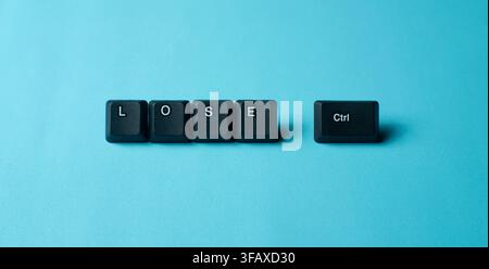 Lose Control Stress Concept With Keyboard Keys On Blue Background representing stress, anxiety, pressure, chaos, and loss of control. Stock Photo