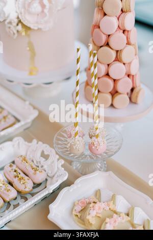 Elegant pastel dessert table with macarons and cake pops Stock Photo