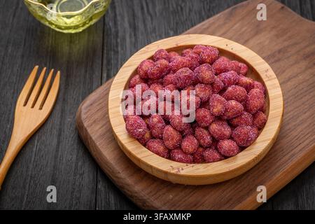 Purple coated crispy peanuts served in small plate Stock Photo