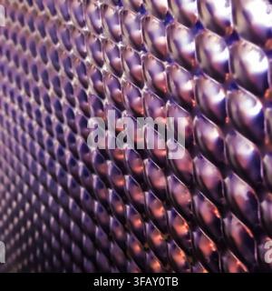 Abstract macro of metallic textured surface. The diagonal pattern creating a futuristic industrial background. Stock Photo