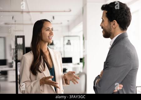 Multiethnic team members engaging in professional discussion and ideas sharing Stock Photo