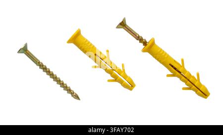 Dowel and screw isolated on a white background. Yellow plastic dowel and metal screw. Stock Photo