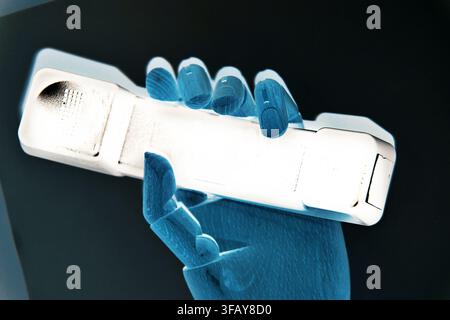 Robotic Hand Holding a Cordless Phone Technology Concept Stock Photo