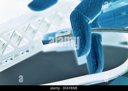 Robotic Hand Connecting USB Cable for Digital Technology Concept Stock Photo