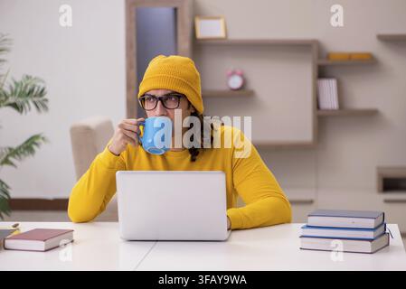 Young student preparing for exams at home Stock Photo