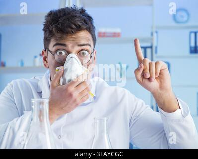 Funny crazy chemist working in a lab Stock Photo