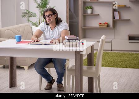 Young student preparing for exams at home Stock Photo