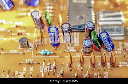 Electronic components resistors and capacitors on vintage TV circuit board Stock Photo