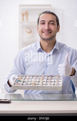 Young male jeweler in workshop Stock Photo