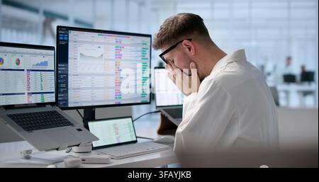 Tired Medical Coder Struggles Managing Hospital Billing Codes Late Night. Stock Photo