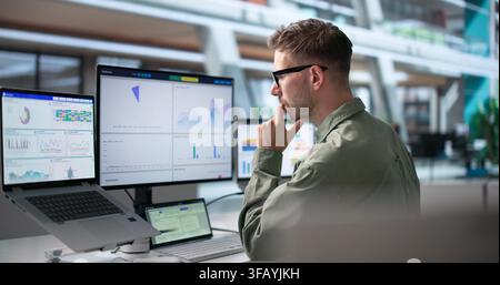 Data Analyst Focused On Financial Dashboard Using Laptop For Business Insights. Stock Photo