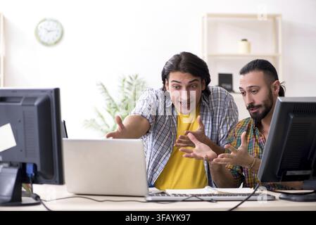 The two IT specialists who work in the office Stock Photo