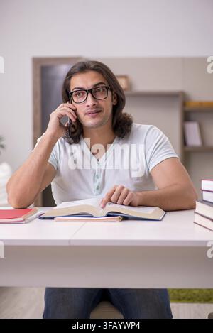 Young student preparing for exams at home Stock Photo