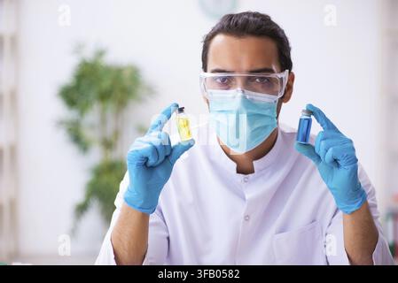Young chemist working in laboratory Stock Photo