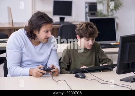 Father and son play computer games Stock Photo