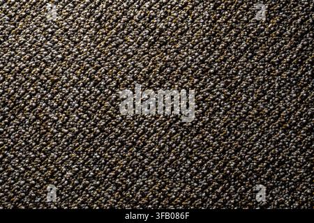 Texture of grey brown loop pile carpet flooring macro. Detailed close up of commercial loop pile carpet texture in brown and grey tones with diagonal Stock Photo