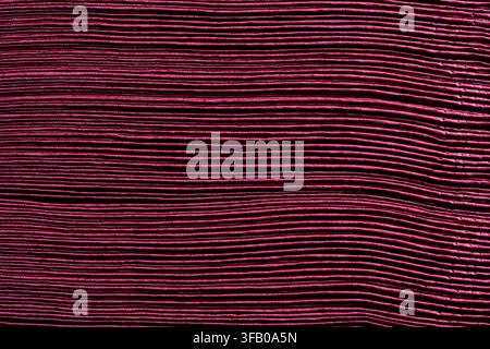 Macro texture of burgundy paper napkins stack. Abstract background dark red corrugated paper sheets with horizontal lines pattern for creative design Stock Photo