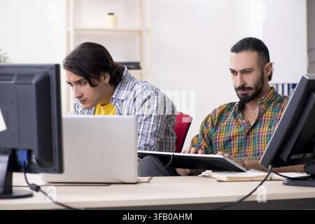 The two IT specialists who work in the office Stock Photo