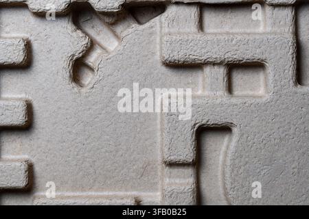 Molded pulp paper packaging material texture. Close up of eco friendly recycled molded pulp protective cardboard packaging tray texture with abstract Stock Photo