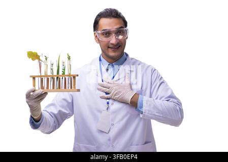 The young male chemist in front of a white background Stock Photo