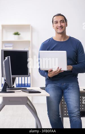 Young IT specialist working in an office Stock Photo