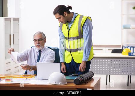 Two architects working in an office Stock Photo